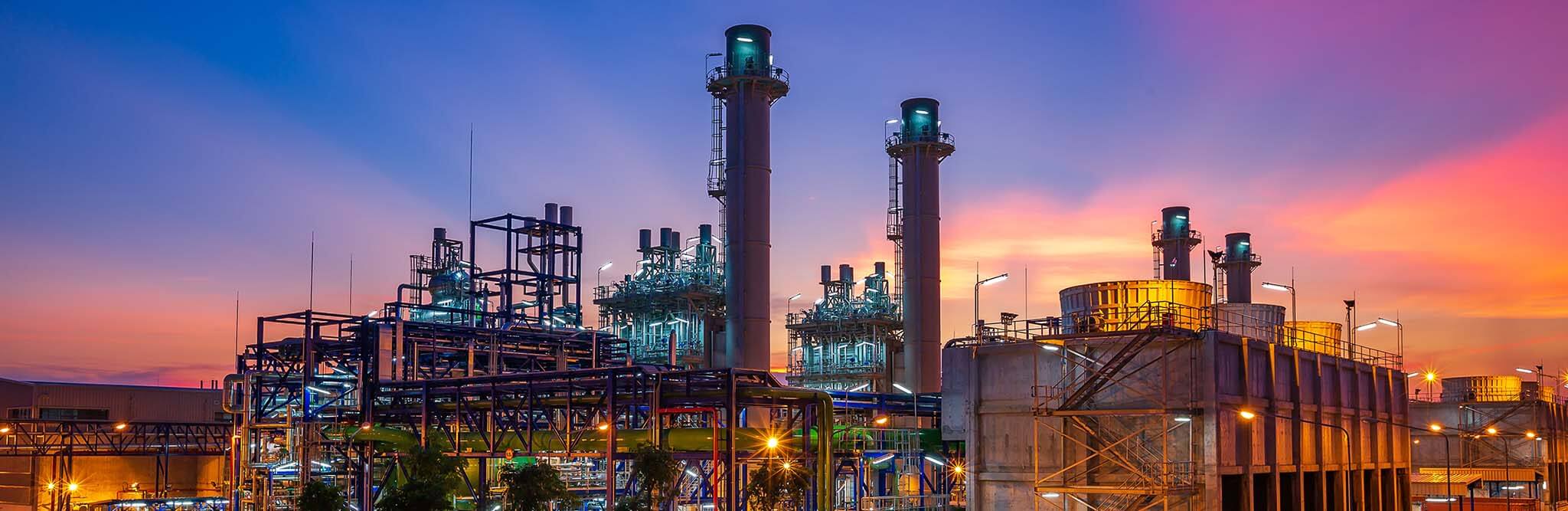 Wide shot of power plant at dawn